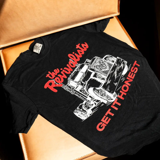Black cotton driven tee featuring a white and red vintage truck graphic with the revivalists and get it honest text