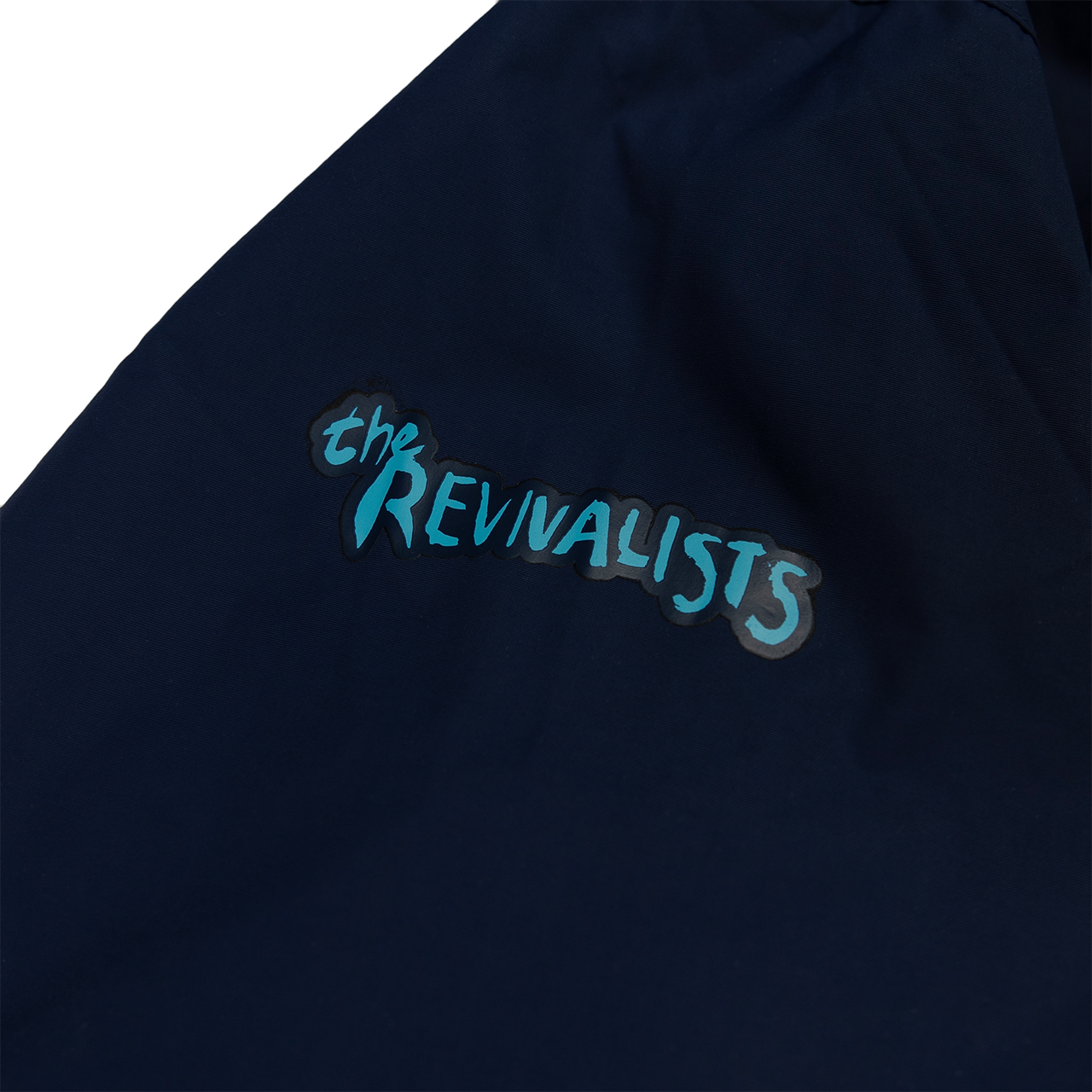 Navy blue fabric with ’the REVIVALISTS’ printed in teal lettering.