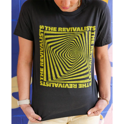 Black t-shirt with yellow geometric spiral design and text reading ’THE REVIVALISTS’ repeated around the edges.