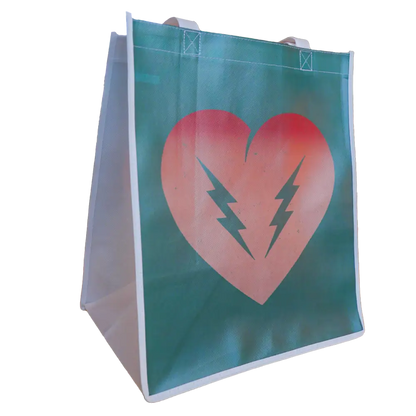 Teal shopping bag with a pink heart and lightning bolt design.