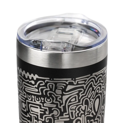 Insulated travel tumbler with intricate black and white abstract design on its exterior.