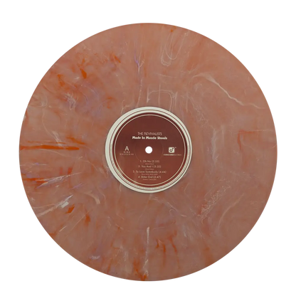 Marbled brown vinyl record with a visible label in the center.