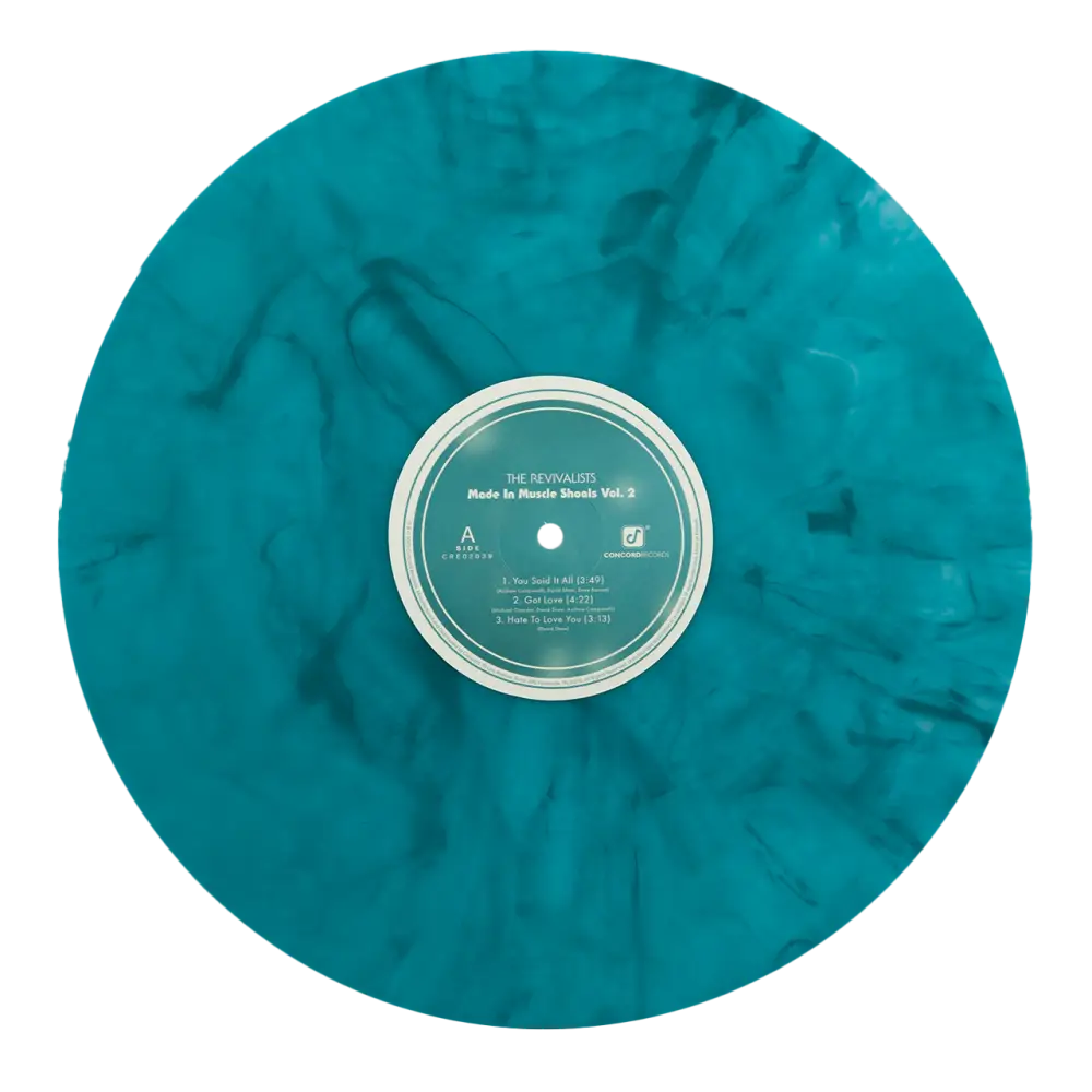 Turquoise marbled vinyl record with a white and green label in the center.