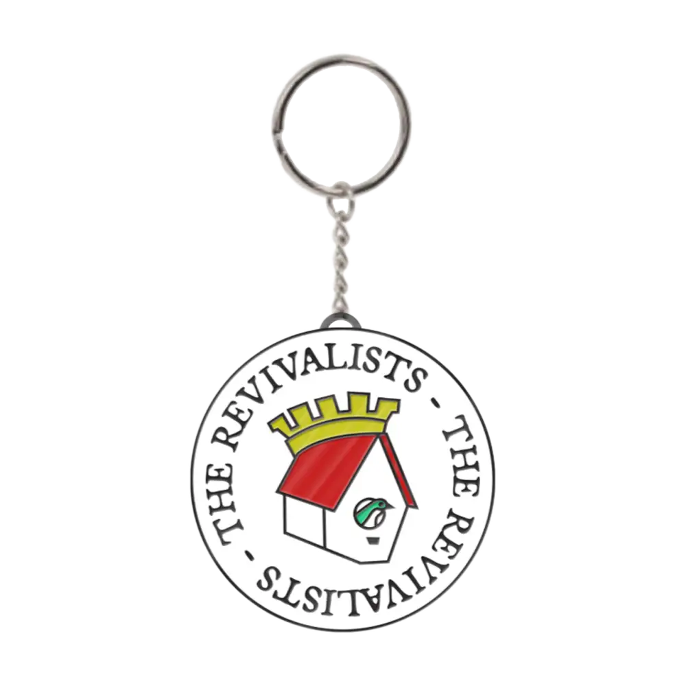 Circular keychain featuring a logo with text and a stylized house design.