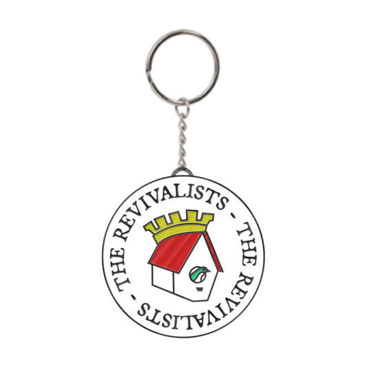 Circular keychain featuring a logo with text and a stylized house design.