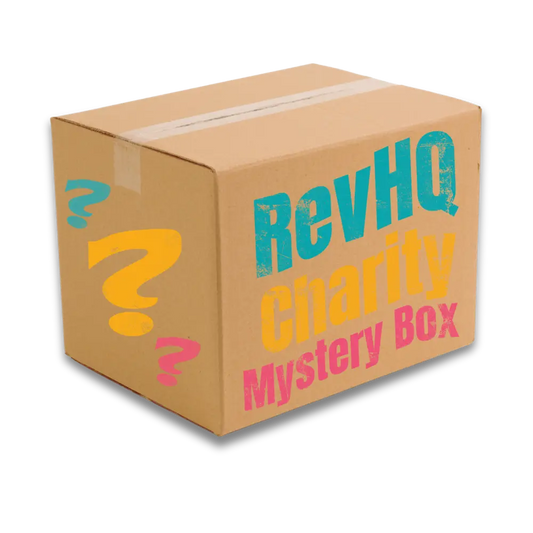 A beige cardboard revhq charity mystery box with colorful distressed lettering and teal yellow pink question marks for mystery revhq boxes