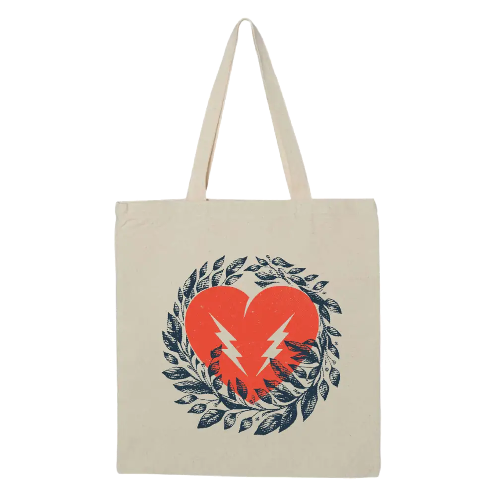 Canvas tote bag with a heart and lightning bolt design surrounded by a wreath of leaves.