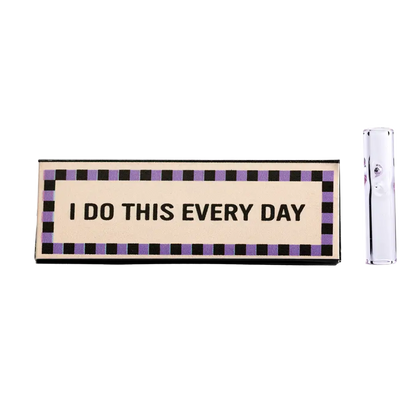 Rectangular sign with the text ’I DO THIS EVERY DAY’ bordered by a checkered pattern.