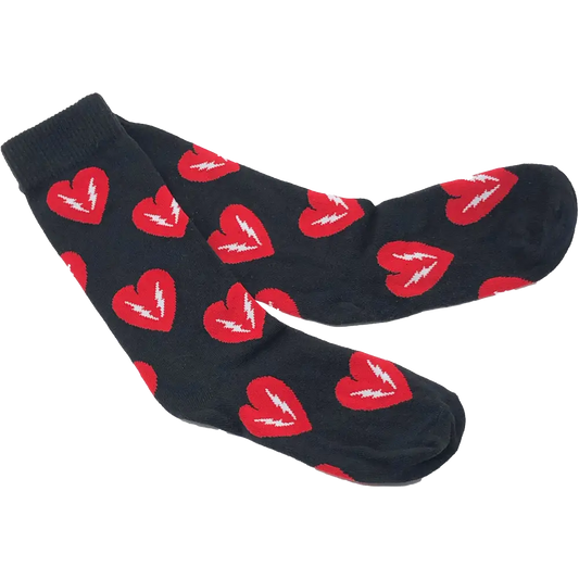 Pair of black socks with red heart patterns.