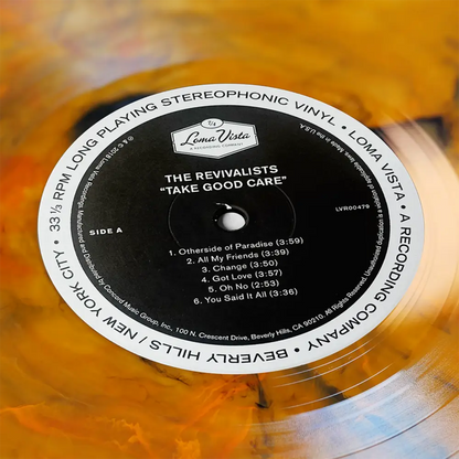 Vinyl record label for The Revivalists’ album ’Take Good Care’ on a translucent orange disc.