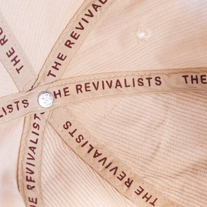 Beige baseball cap with ’THE REVIVALISTS’ text repeated around the crown.